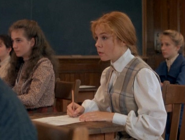 Anne taking an exam at Queen's Academy to be a teacher. 