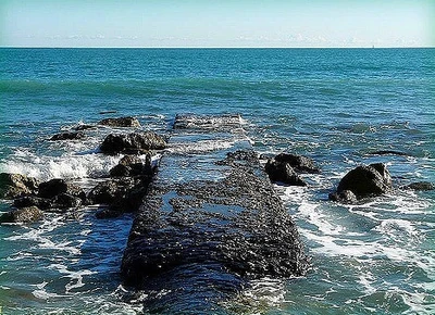 Water washing over a small jetty in Èze, France.