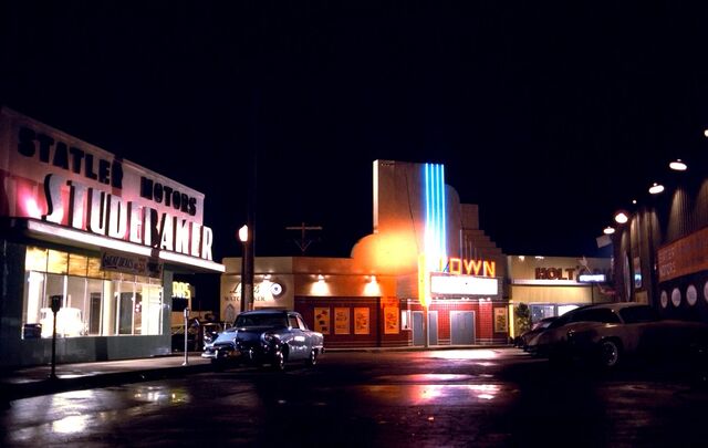 File:Statler Studebaker, Louis Watch Maker, Town Theater and Holt's Diner by night.jpg