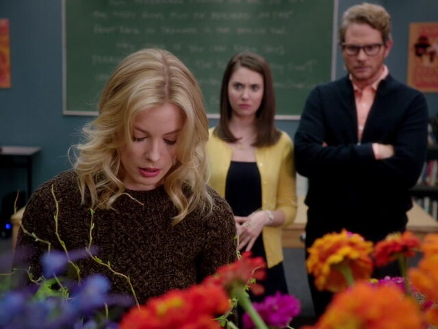 File:3x12-Britta arranges flowers.jpg