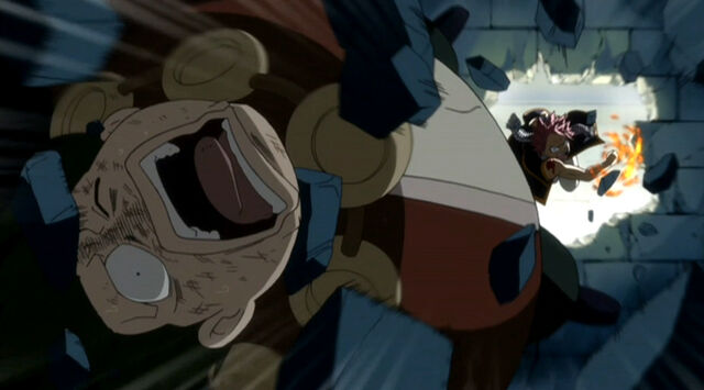 File:Natsu beats Karcka after he tries to kill his guildmate.jpg