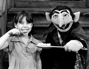 The Count brushing teeth