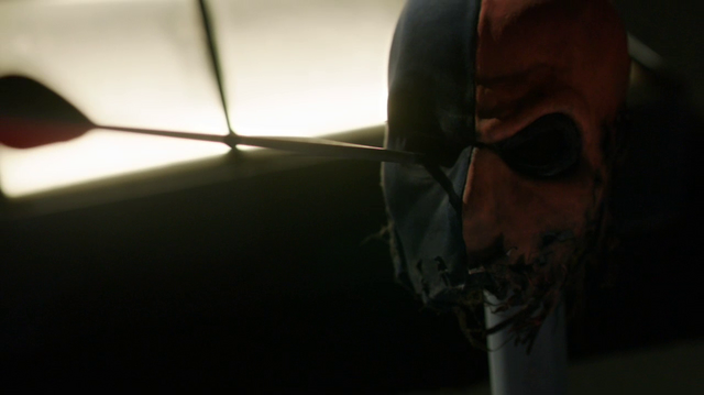 File:Slade taunts Oliver with his mask.png