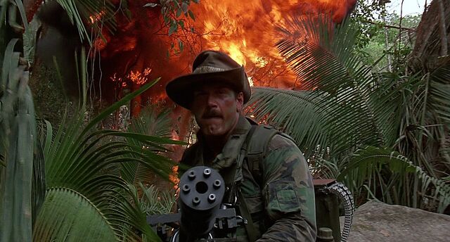 File:Blain armed with minigun.jpg