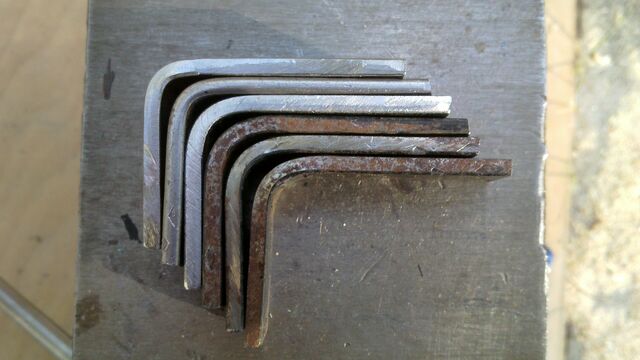 File:Bending pi-brackets using a wooden tool - 02.jpg