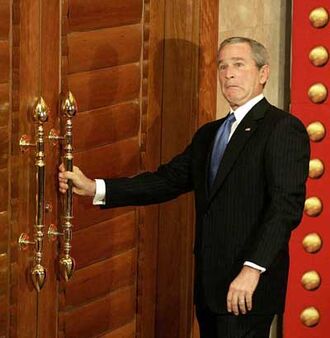 George-bush-trying-to-open-door.jpg