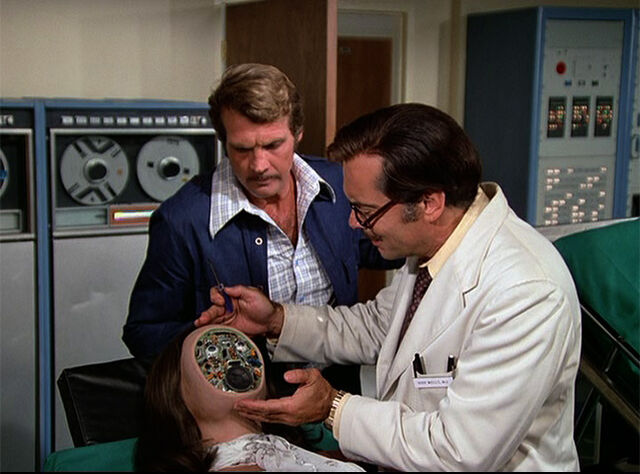 File:Rudy examines fembot.jpg