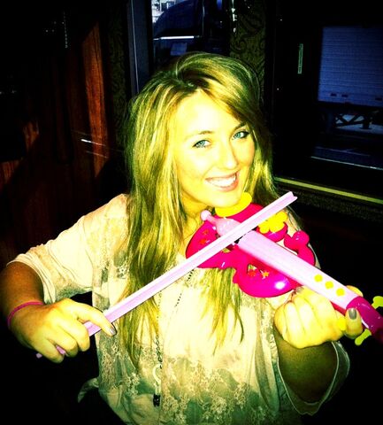File:Playing the toy violin.jpg