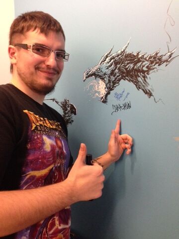 File:Sergej signs the wall.jpg
