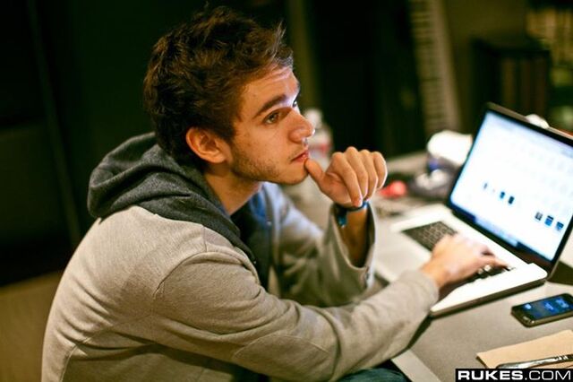 File:A man seated at a computer.jpg