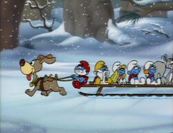 Smurfs riding a sled