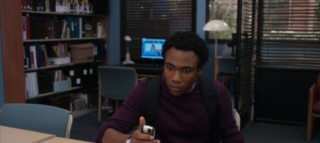 File:Troy receives Chang's voice message.jpg