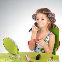 Glamour-Girl-With-Cosmetics-In-front-of-the-mirror-1-