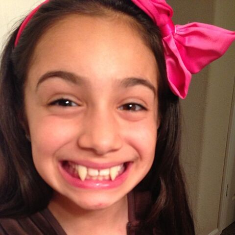 File:McKenzie fake vampire teeth.jpg