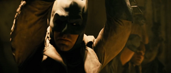 Batman chained up in Superman's bunker