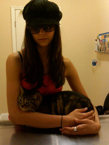 File:Nina and her cat at the vet.jpg