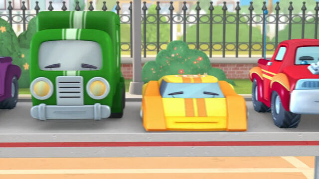 File:Green truck yellow racecar.jpg