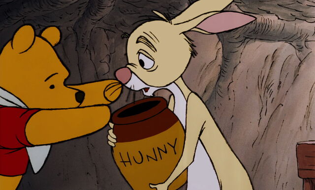File:Winnie the Pooh is about to take Rabbit's honey pot.jpg