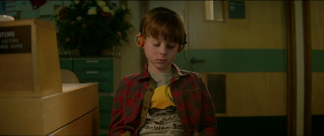 File:YoungPeterQuilllistingtohiswalkmen.png