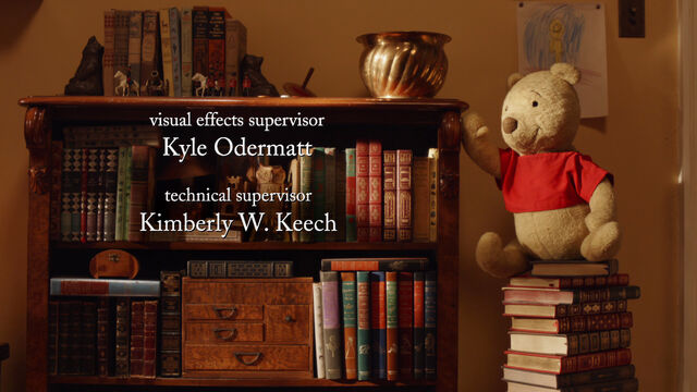 File:Winnie the Pooh is a stuffed bear on a stack of books to get the honey pot.jpg