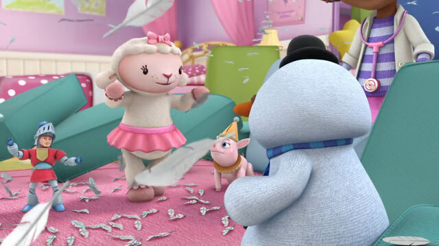 File:Lambie thinks the feathers are baaaa-utiful.jpg