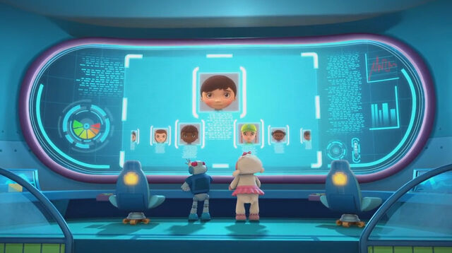 File:Lambie and robot ray looking at the kids on screen.jpg