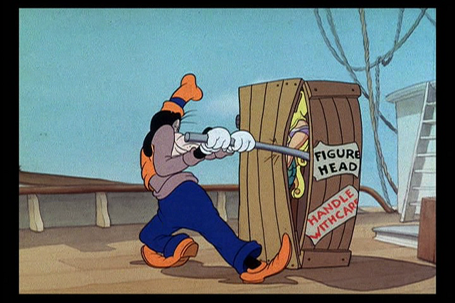 File:Goofy opening up a mermaid crate.png