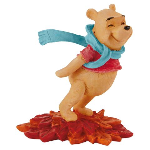 File:Pooh-leaning-in-the-wind-figurine-root-Hallmark.jpg