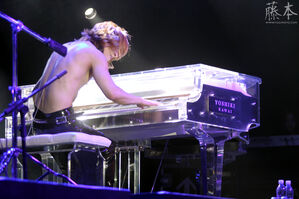 Yoshiki playing the piano