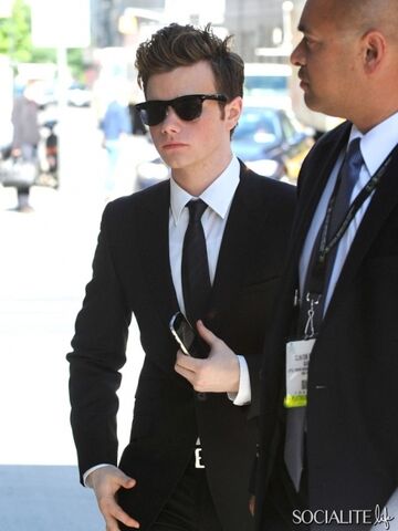 File:Chris-colfer-star-of-the-hit-tv-show-glee-sports-a-black-suit-and-dark-sunglasses-while-out-and-about-in-soho-2.jpeg