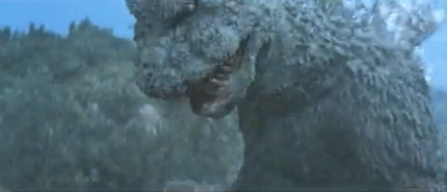 File:SoshingekiGoji Godzilla violently beats up Gabara.png