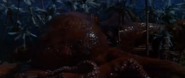 File:King Kong vs. Godzilla - 16 - Oodako Attacks Two People In A House.png