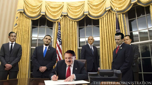 File:President Hitler signs his first executive order.jpeg