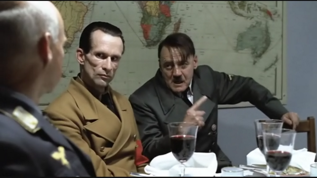 File:Hitler Explains scene hand gesture 2 goebbels stares.png