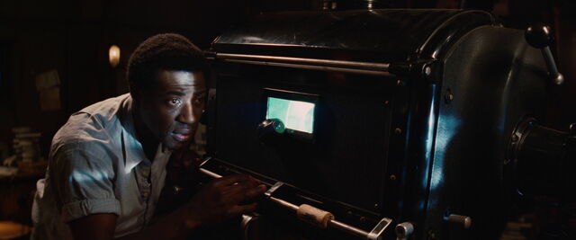 File:Marcel looks at the film.jpg