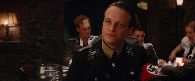 File:Dieter Hellstrom looks directly at Archie Hicox.jpg