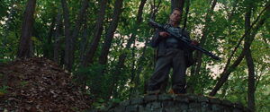 Hugo Stiglitz with a MG42 machine gun