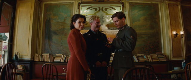 File:Amour Babette looks at Shosanna.jpg