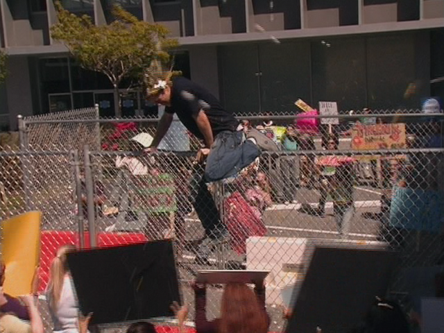 File:1x2 Dennis climbs fence.png