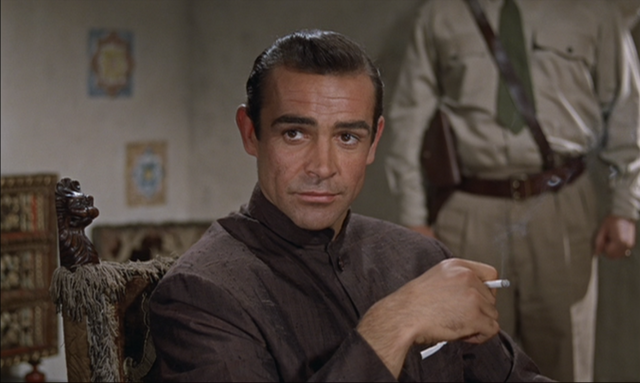 File:Dr No - Bond at dinner.png