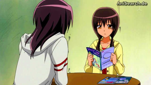 File:Suzuna reads magazines.jpg