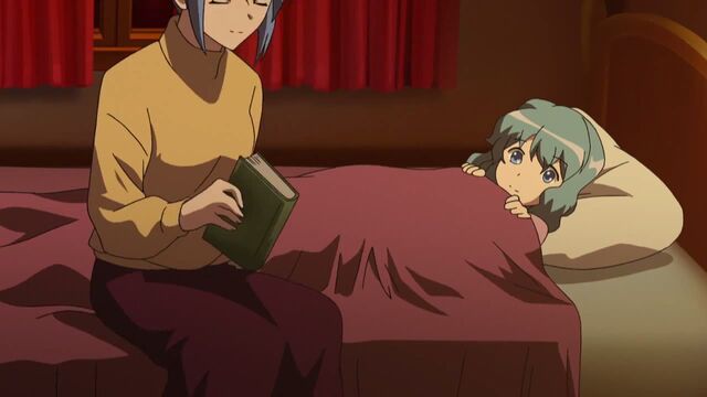 File:A child getting told a bedtime story by her mother on Christmas Eve.jpg