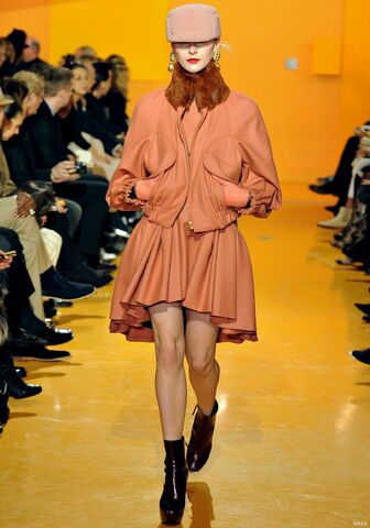 File:Kenzo Fall Winter 2012 peach round neck dress with fitted bodice and pleated flared skirt with asymmetrical hemline.jpg