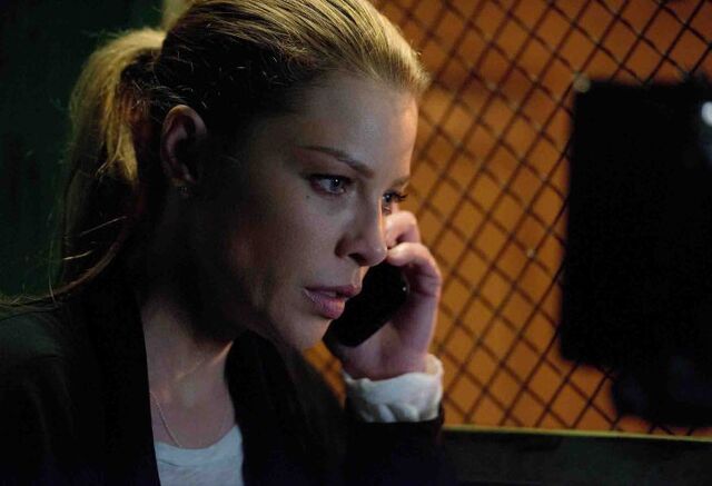 File:104 Chloe on phone.jpg