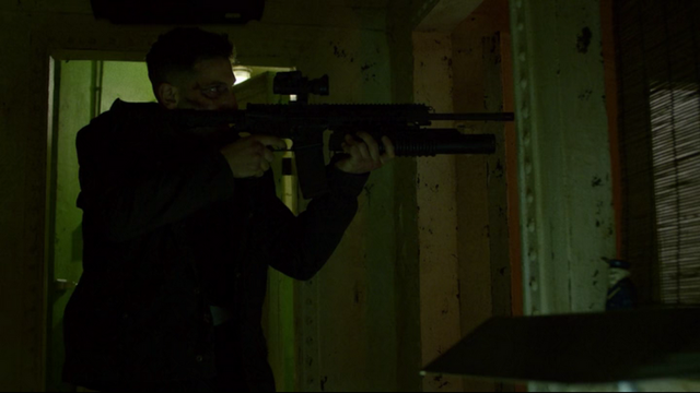 File:Punisher uses his gun.png