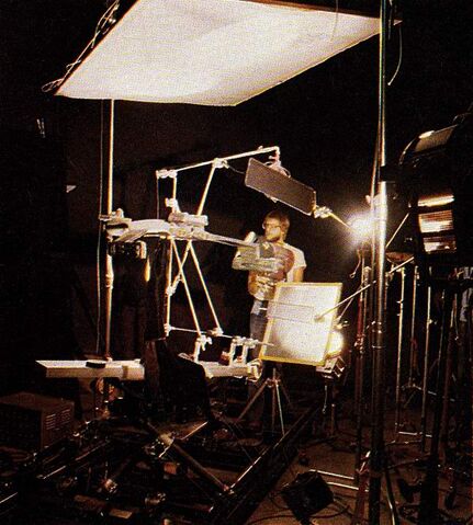 File:Greg Kimble adjusting the lighting on the K't'inga class studio model prior to filming.jpg