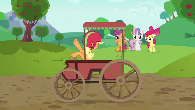 File:Applejack coasts past screen in traditional cart S6E14.png