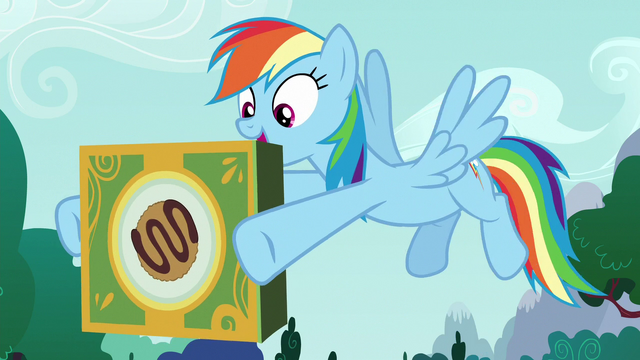 File:Rainbow Dash holding box of joke cookies S6E15.png