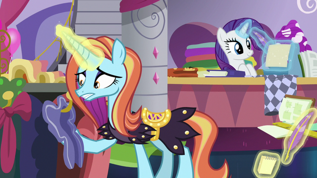 File:Sassy Saddles examining clothes on display S7E6.png