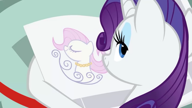 File:Rarity looking at a news ad S2E23.png
